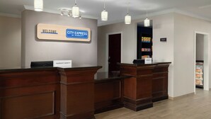 A reception area with a 'Welcome' sign, a 'City Express by Marriott' sign, and a 'Bonvoy' sign. - City Express by Marriott Washington, DC Northeast (Washington)