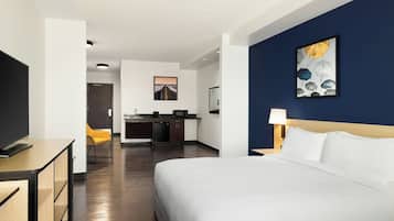 Premium bedding, desk, laptop workspace, blackout drapes