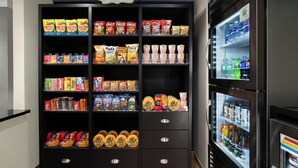 A vending machine stocked with snacks and beverages. - City Express by Marriott Washington, DC Northeast (Washington)