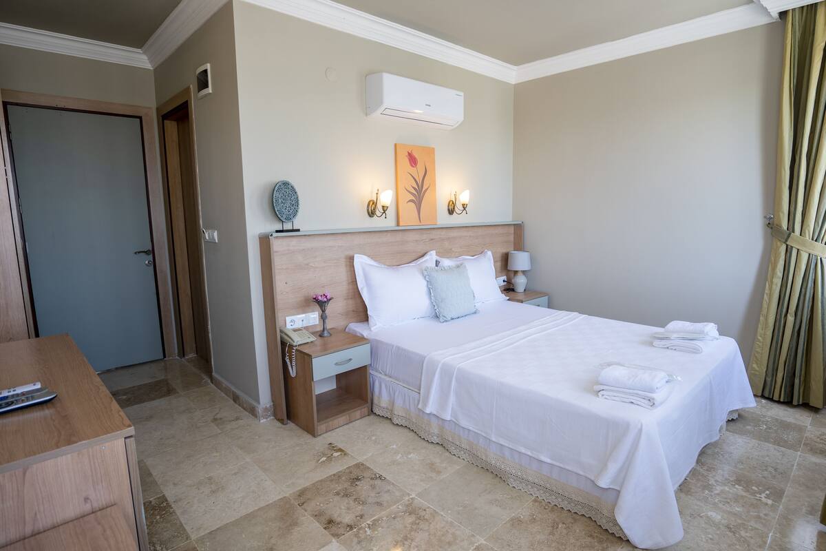 Quarto luxo, vista parcial para o mar | Quartos à prova de som, roupa de cama