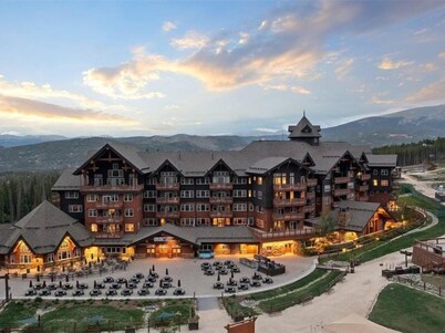 Expansive 4 Bedroom Ski in, Ski out One Ski Hill Residence Located at the Base of Peak 8 with Beautiful Views