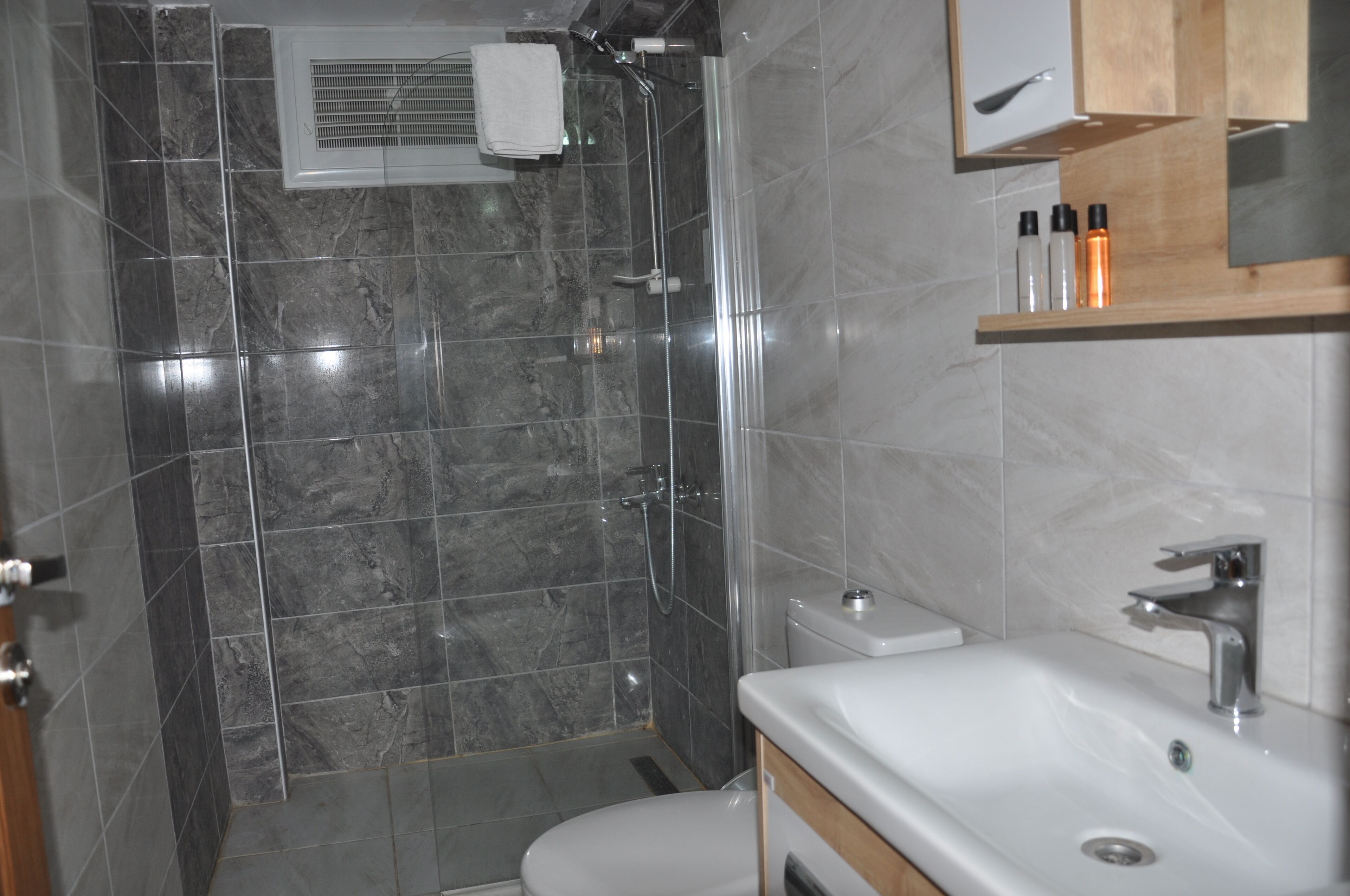 family suite | bathroom | shower, free toiletries, hair dryer, slippers