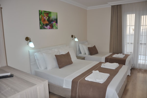 Standard Triple Room | Premium bedding, desk, blackout drapes, soundproofing
