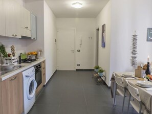 Fridge, oven, highchair, cookware/dishes/utensils