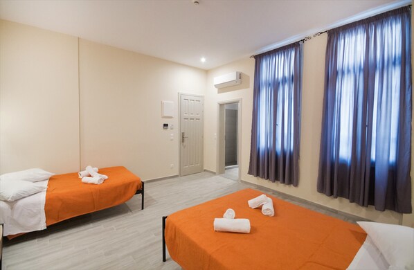 Standard Quadruple Room, 2 Double Beds | 1 bedroom, desk, blackout curtains, iron/ironing board