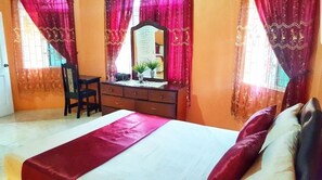 A bedroom with a bed, a dresser, a chair, and a mirror. - I Heart JA Me Lo Dio Dios Ocho Rios (Ocho Rios)