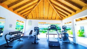 A gym with treadmills, elliptical machines, and dumbbells. - I Heart JA  Coastal DreamVIlla-Richmond Estates (St. Ann's Bay)