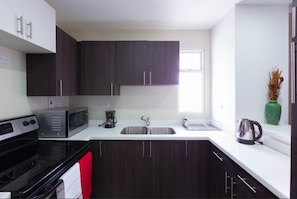 Full-sized fridge, microwave, oven, stovetop - I Heart JA Affordable Luxury at The Bromptons (Kingston)