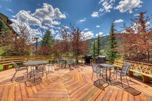 Enjoy dining or socializing on the deck with tables and chairs.