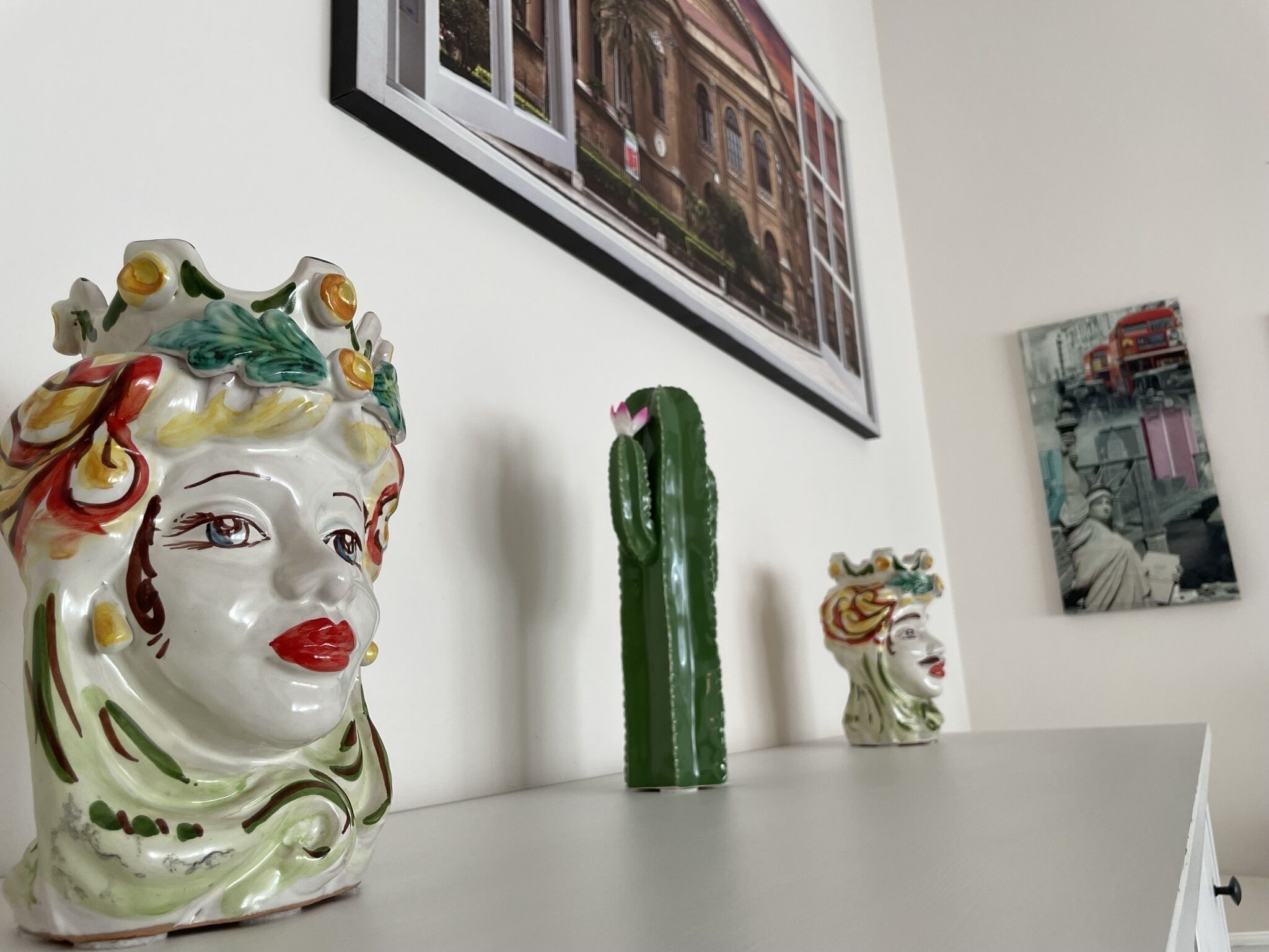 A ceramic vase with a floral design on a table.