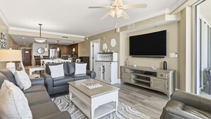 A modern living room with a sofa, coffee table, and TV.
