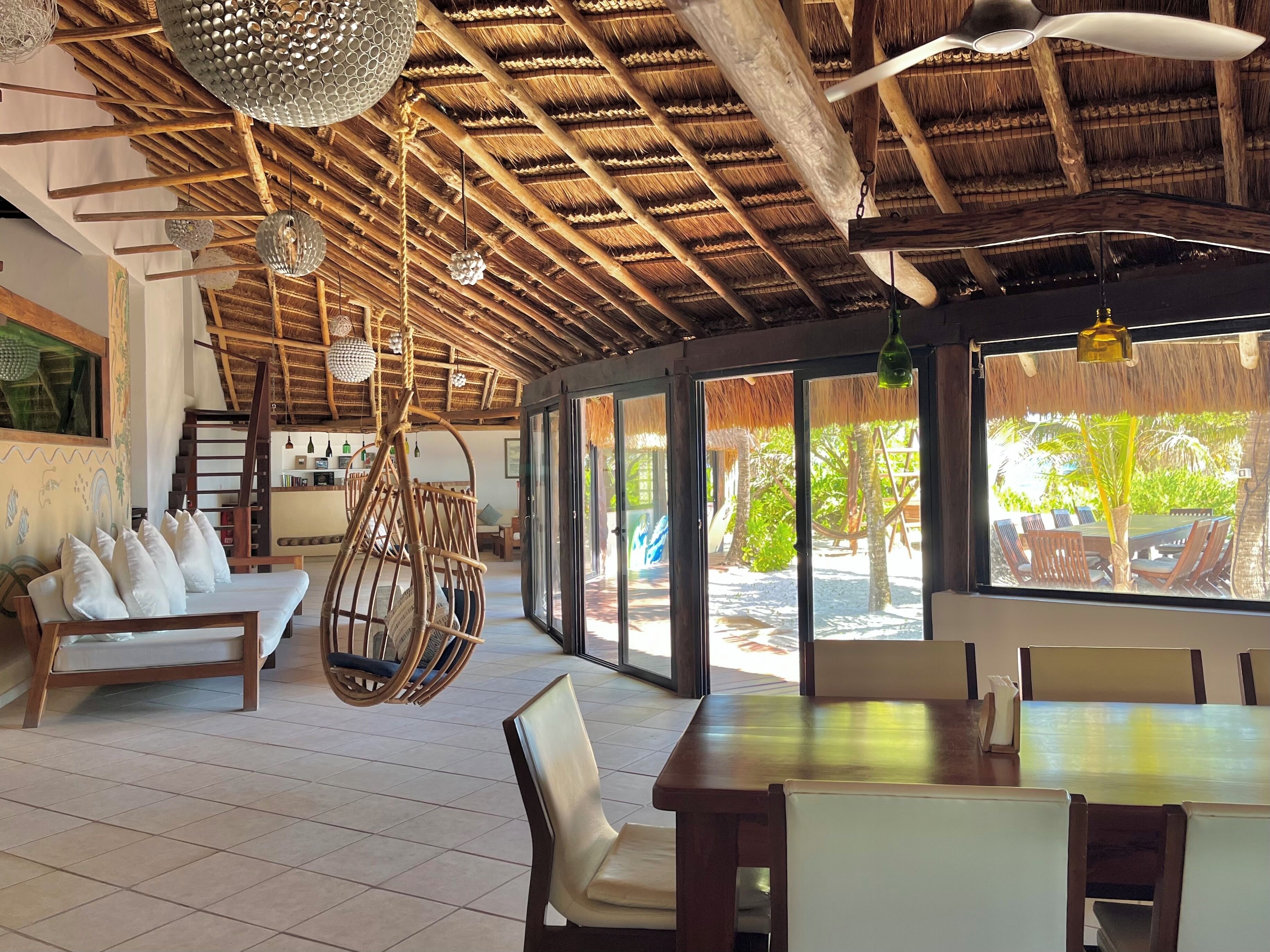 indoor living/dining extend directly through sliding glass doors to the terrace