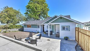 A single-story house with a patio, outdoor seating, and a fenced yard. - Waterfront Home ~ 6 Mi to Olympic National Park! (Port Angeles)