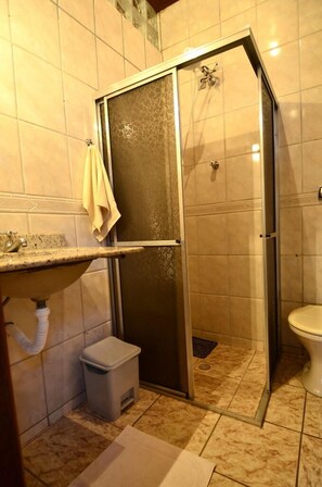 Shower, towels, soap, toilet paper