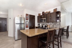 Coffee/tea maker, fridge, microwave, oven