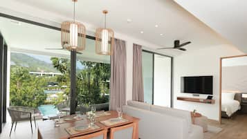 Two Bedroom Suite Pool View | Living area | 55-inch LED TV with satellite channels, TV