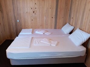 Desk, laptop workspace, iron/ironing board, bed sheets