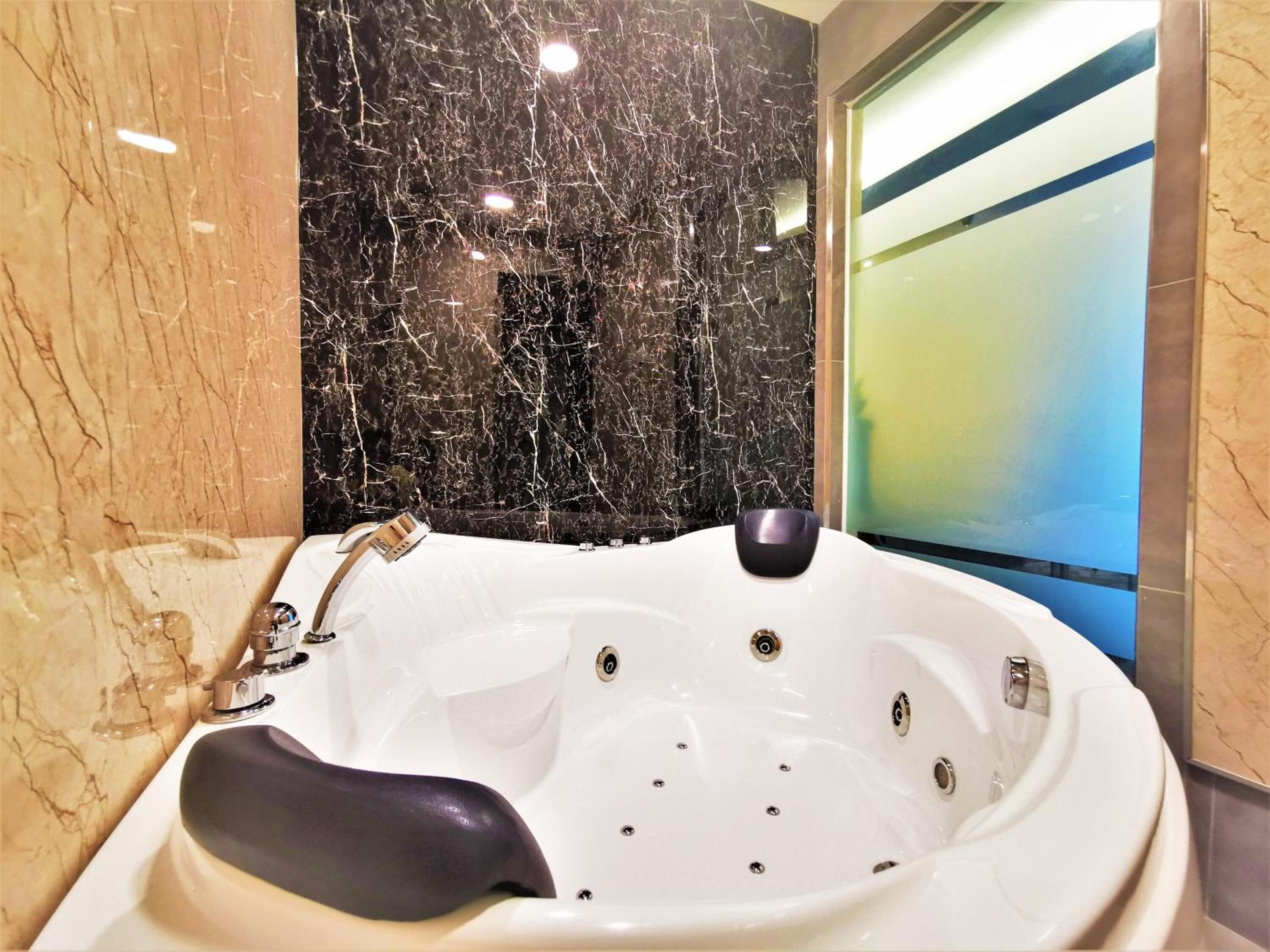 shower, hair dryer, slippers, towels