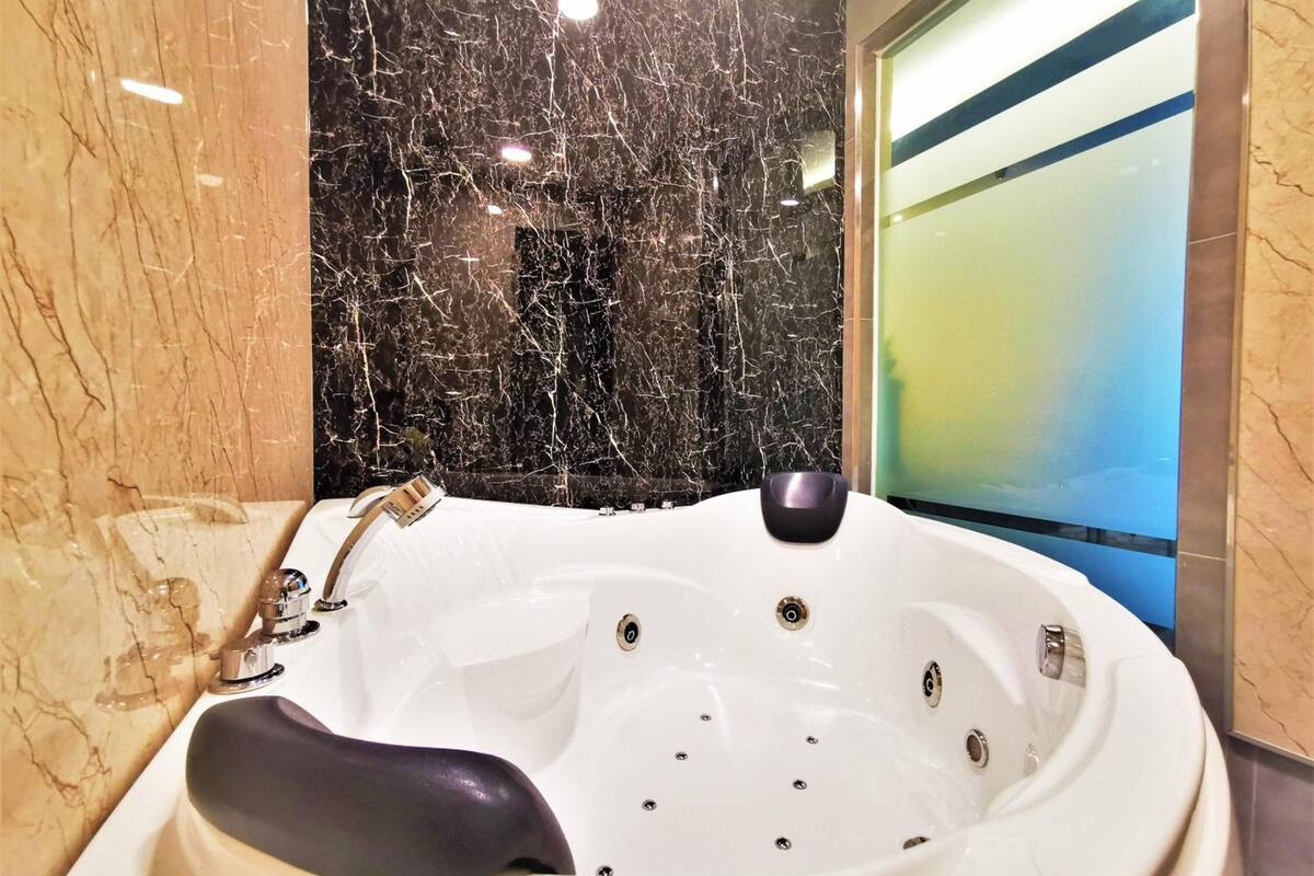 shower, hair dryer, slippers, towels