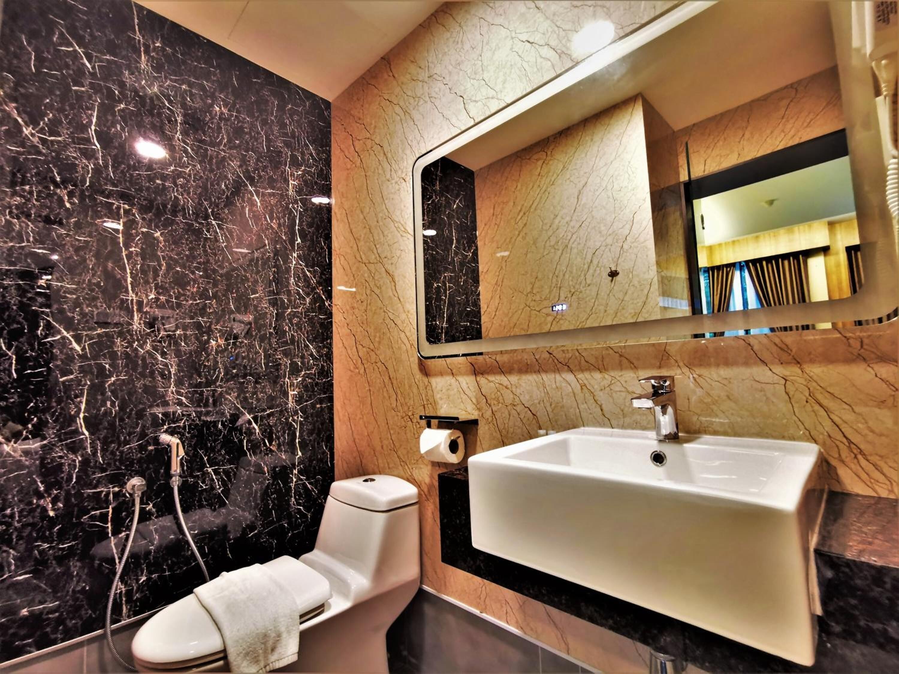 shower, hair dryer, slippers, towels