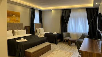 Family Quadruple Room | Down comforters, minibar, in-room safe, desk