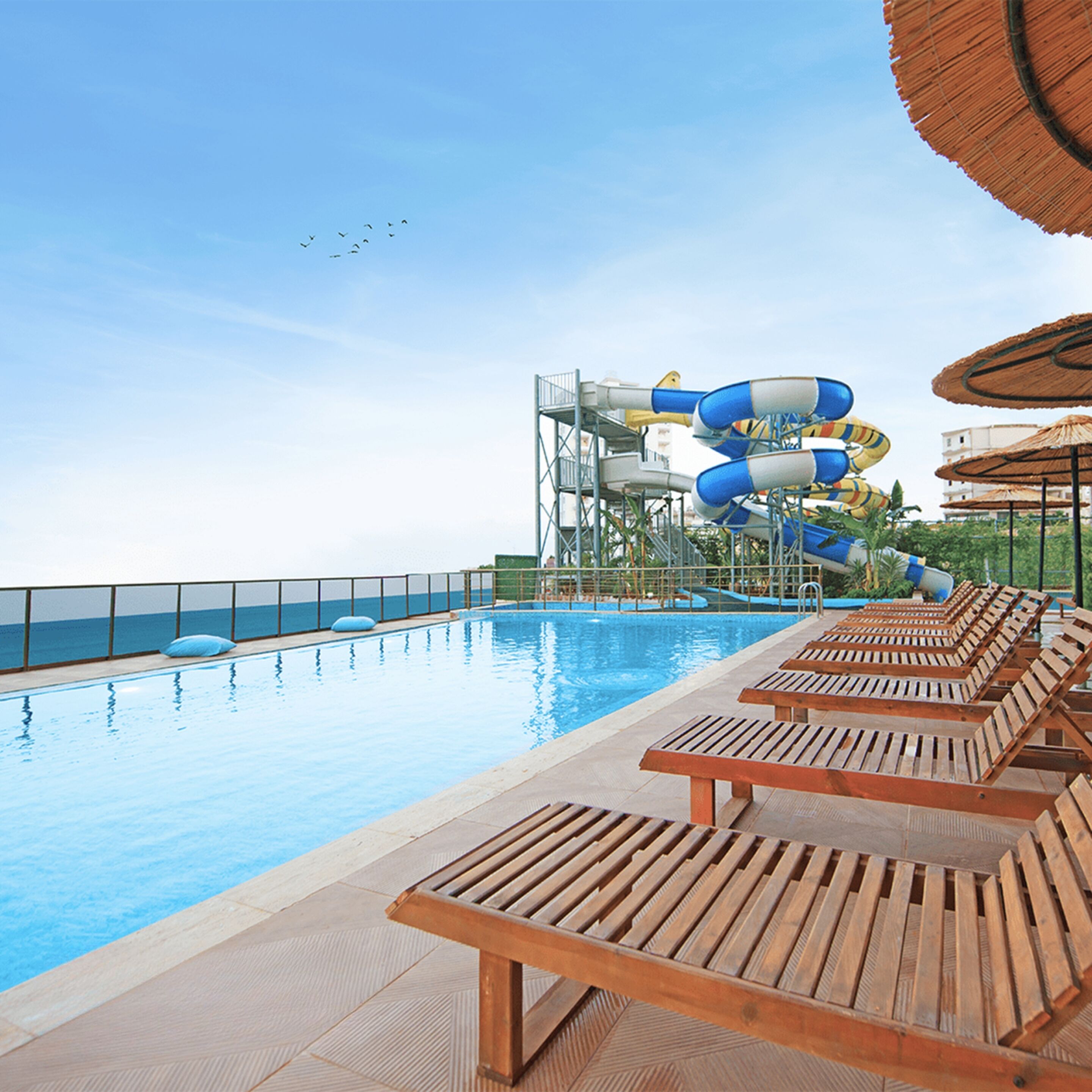 4 outdoor pools, open 10:00 AM to 6:00 PM, pool umbrellas, pool loungers