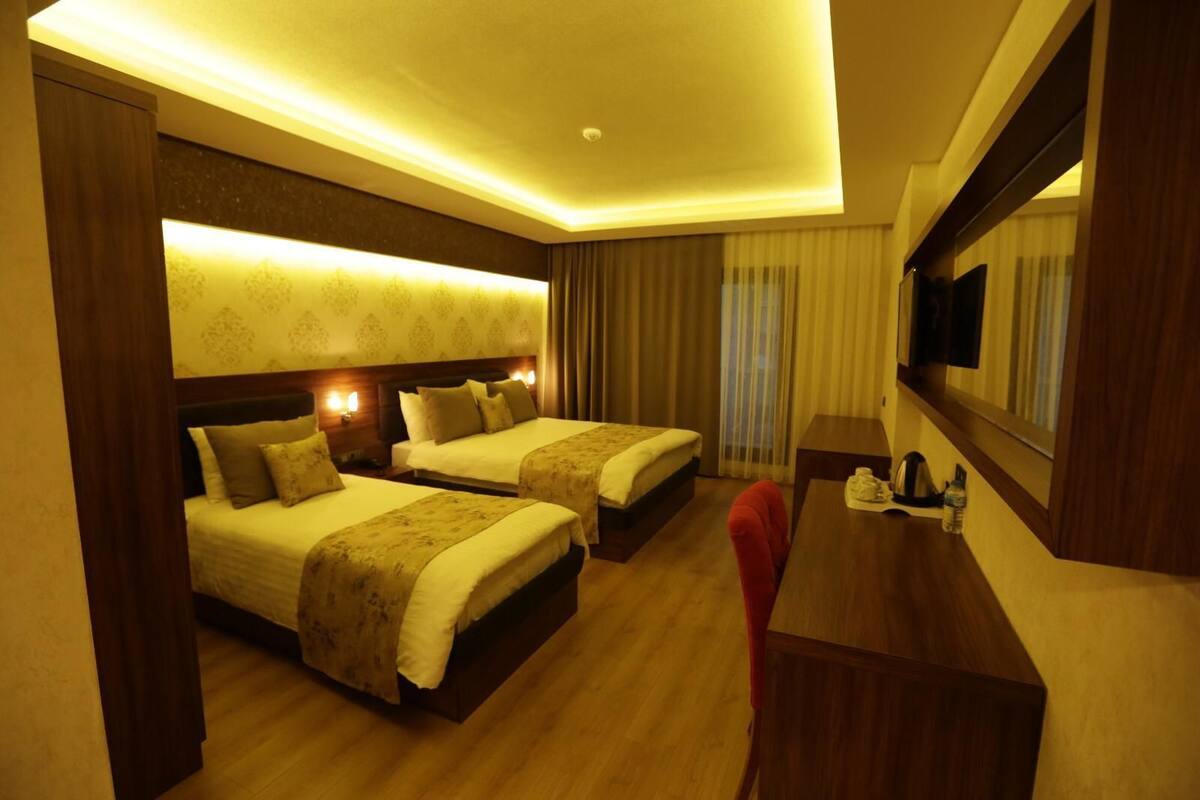 Family Triple Room, City View | Premium bedding, free minibar items, in-room safe, desk