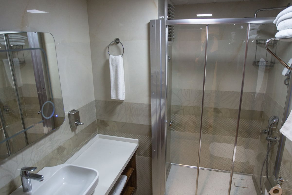 family triple room, city view | premium bedding, free minibar items, in-room safe, desk