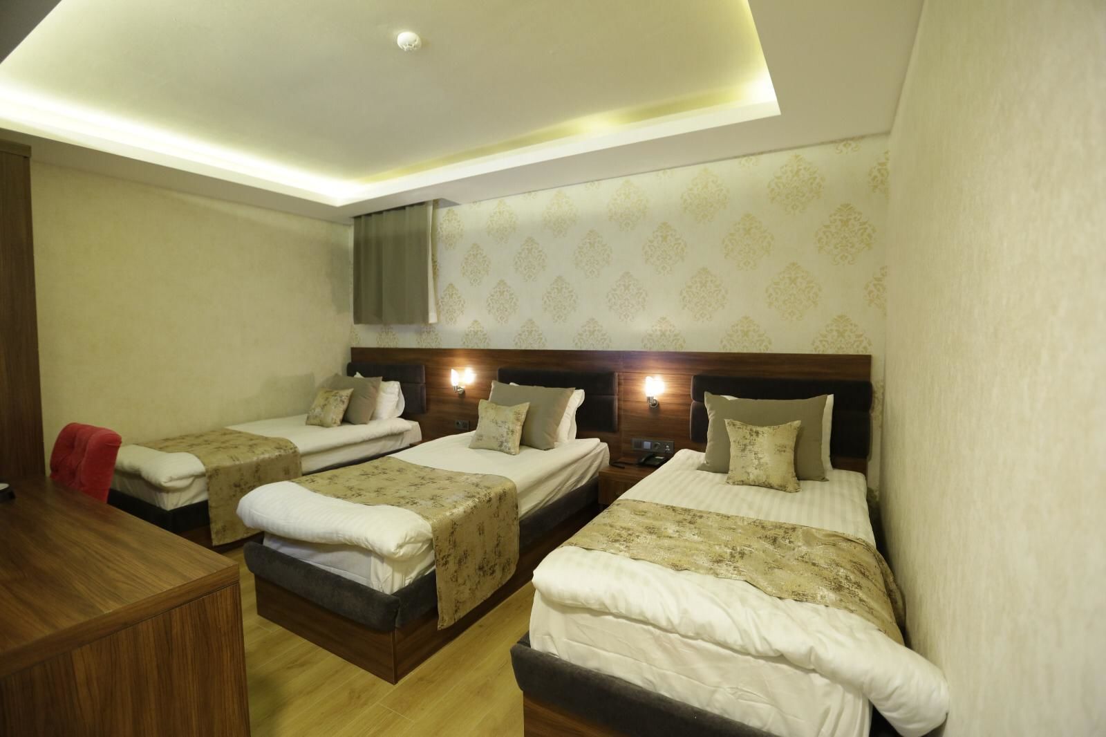 family triple room, city view | premium bedding, free minibar items, in-room safe, desk