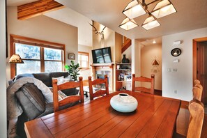 Relax in a warm and inviting space with a comfortable sofa, couch, and dining table.