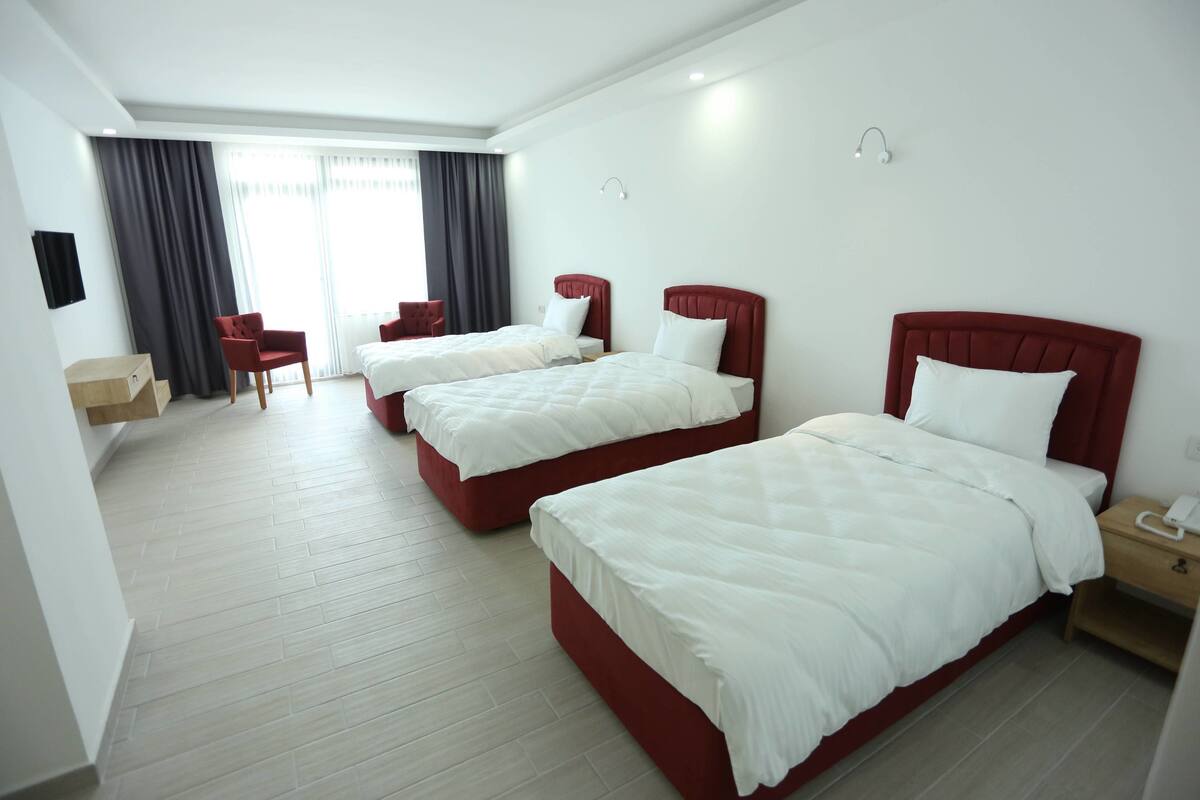 Triple Room, Sea View | Hypo-allergenic bedding available, laptop workspace, blackout drapes