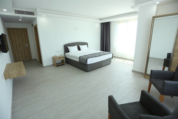 Hypo-allergenic bedding, laptop workspace, blackout drapes