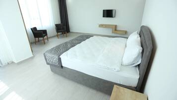 Hypo-allergenic bedding, laptop workspace, blackout curtains