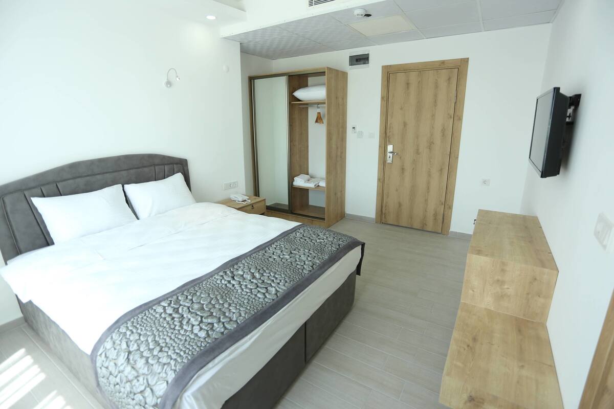Comfort Double Room, Partial Sea View | Hypo-allergenic bedding available, laptop workspace, blackout drapes