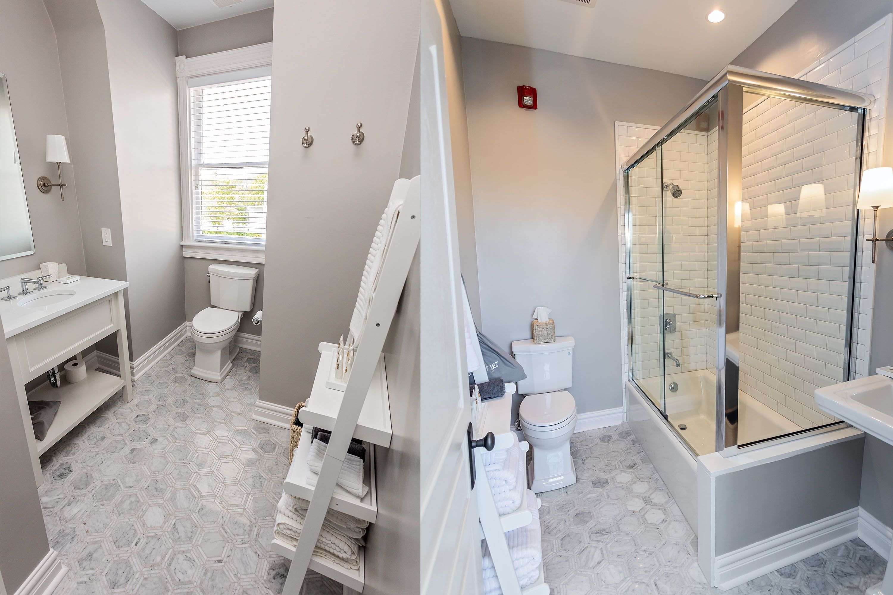 A bathroom with a glass-enclosed shower, a toilet, and a sink.