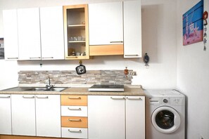 Fridge, freezer, dining tables