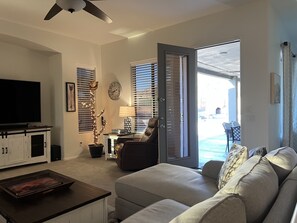 Smart TV, fireplace, books, printers