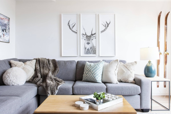 Cozy living room with gas fireplace, seating for 6, patio access to BBQ and view