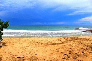 On the beach, sun-loungers