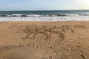 On the beach, sun loungers, beach towels