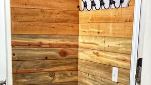A corner of a room with wooden paneling and a bench. - Cozy, updated 2 Bedroom / 2 Bathroom condo (Steamboat Springs)