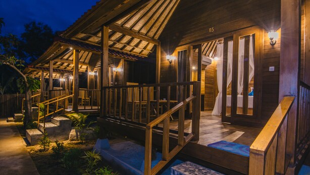 A wooden building with a covered porch, steps leading to the entrance, and a number '05' on the wall. - Nerima Hut Lembongan (Lembongan Island)