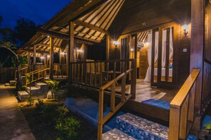 A wooden building with a covered porch, steps leading to the entrance, and a number '05' on the wall. - Nerima Hut Lembongan (Lembongan Island)