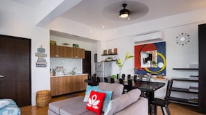 Family Studio Suite | Living area | 20-inch flat-screen TV with cable channels, TV