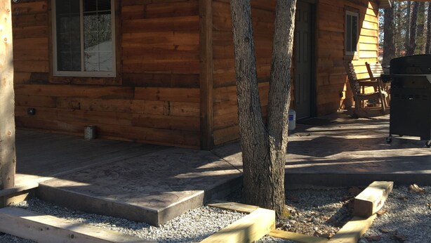 A wooden cabin with a window, a door, and a porch area with steps leading to the entrance. - #4 Fall Creek Cabins family friendly 1 mile from Lake Norfork , Mtn. Home Ar. (Mountain Home)