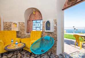 Deluxe Chalet, Sea View | Living area | 50-inch LCD TV with satellite channels, TV - The Dream Compound-  by Biankini Dead Sea (Kalya)