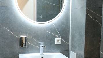 Deluxe Double Room, 1 Double Bed | Bathroom | Shower, hair dryer, slippers, bidet