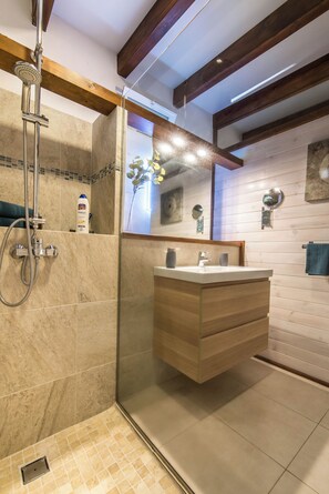 Shower, hair dryer, towels, soap