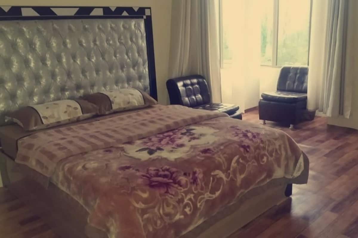 Quarto casal luxo, vista para a montanha | Área de estar