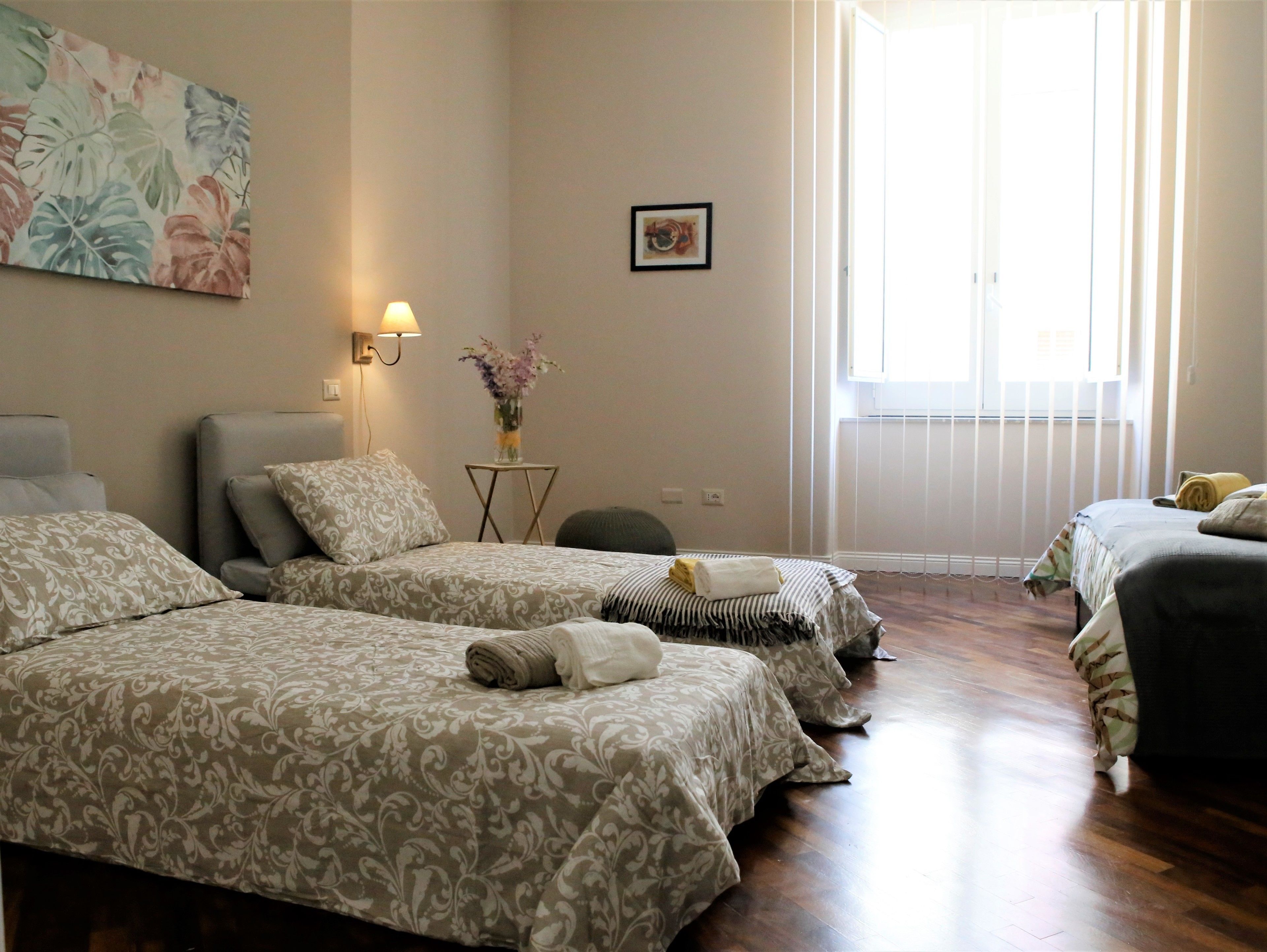 Deluxe Quadruple Room, Multiple Beds | Individually furnished, desk, laptop workspace, soundproofing